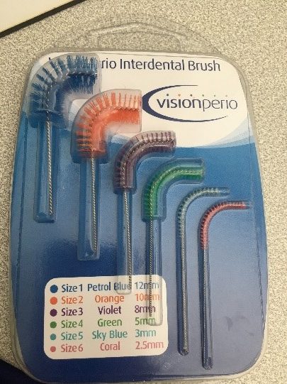 Curved interdental brushes